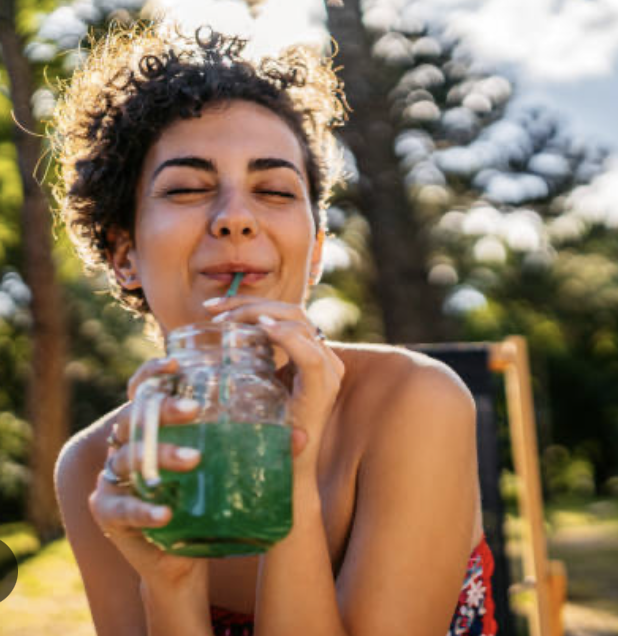Woman Drinking Cleansing Green Juice