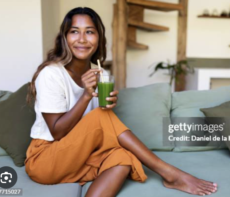 Woman Drinking Cleansing Green Juice