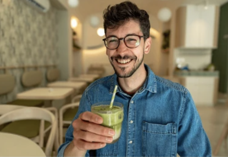 Man Drinking Cleansing Green Juice