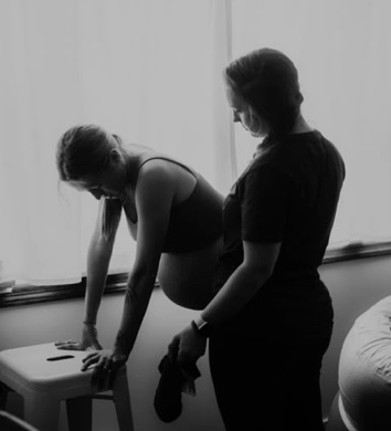 Woman in Labour during Contractions with her Doula