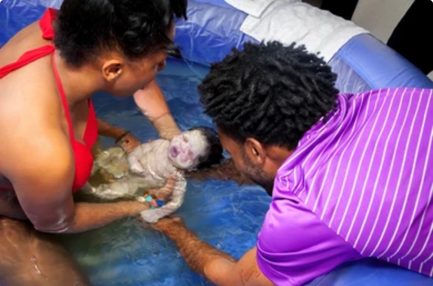 Mother Giving Birth in Birthing Pool