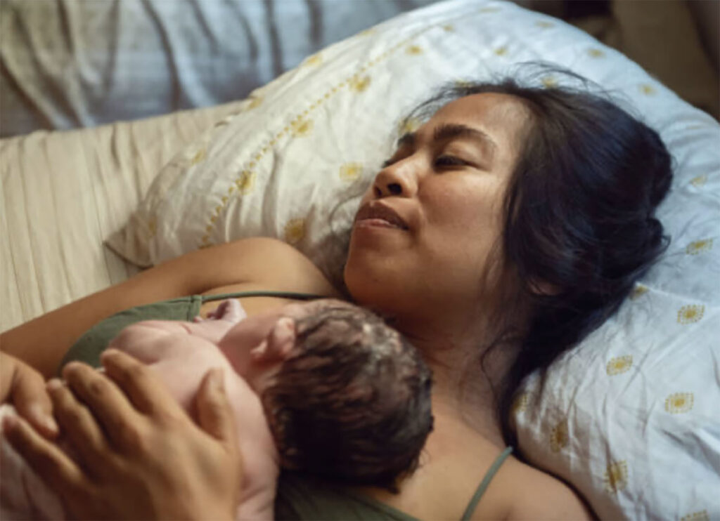 New Mum Holding Baby