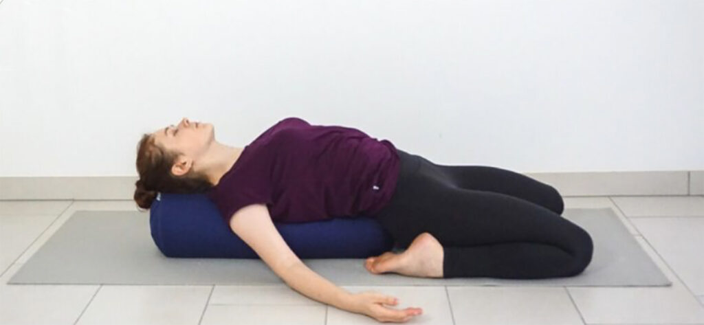 Yin Yoga Supta Vrasana with Bolster